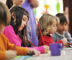 Preschool children painting to support creativity and learning
